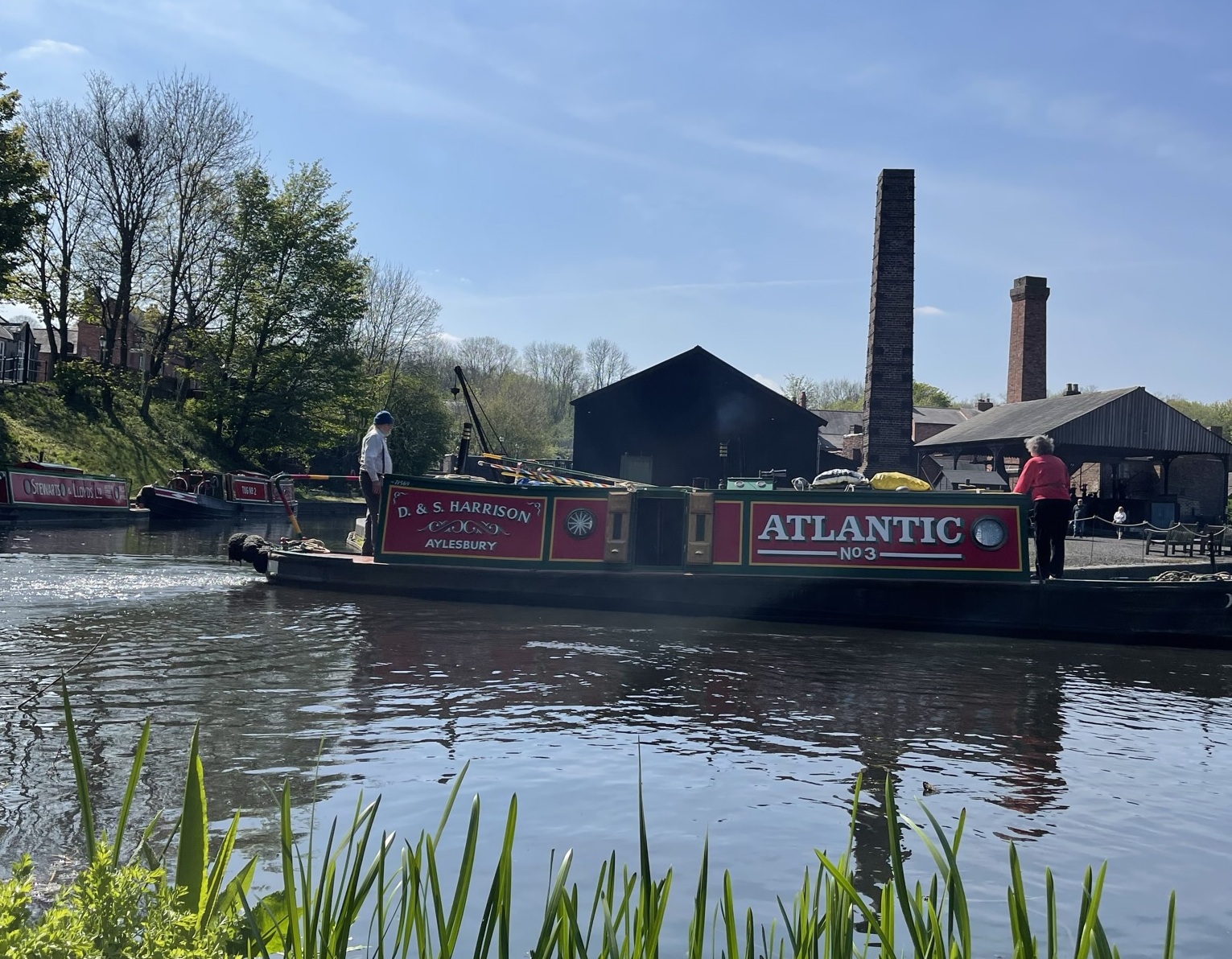 Tug Boat, Atlantic, mooring up to the Black Country Museum's Boat Dock with beautiful blue skies over an industrial landscape. 